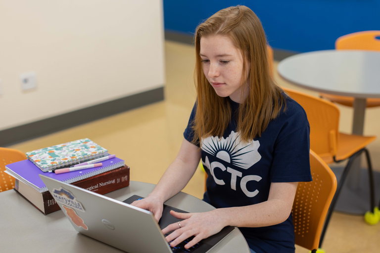 MCTC student working on a laptop