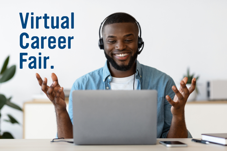African American student in front of a computer with headset on.