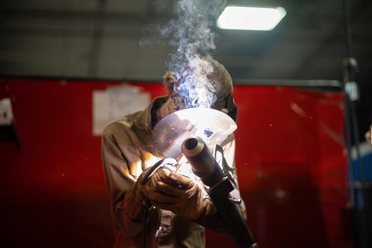 action shot of student welding