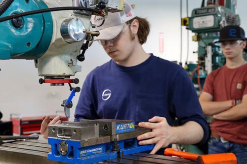 a student working with a 3d printer