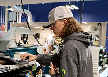 Trade Wars student in the Computerized Manufacturing and Machining Lab