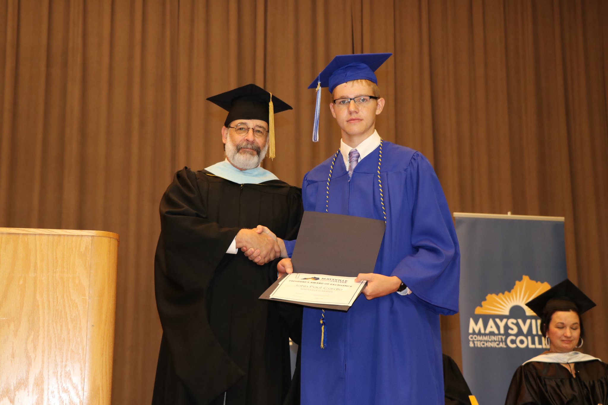 MCTC President's Award of Excellent Recipient Cordle at graduation.