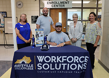 Joey Nelson signing with MCTC Workforce Solutions.
