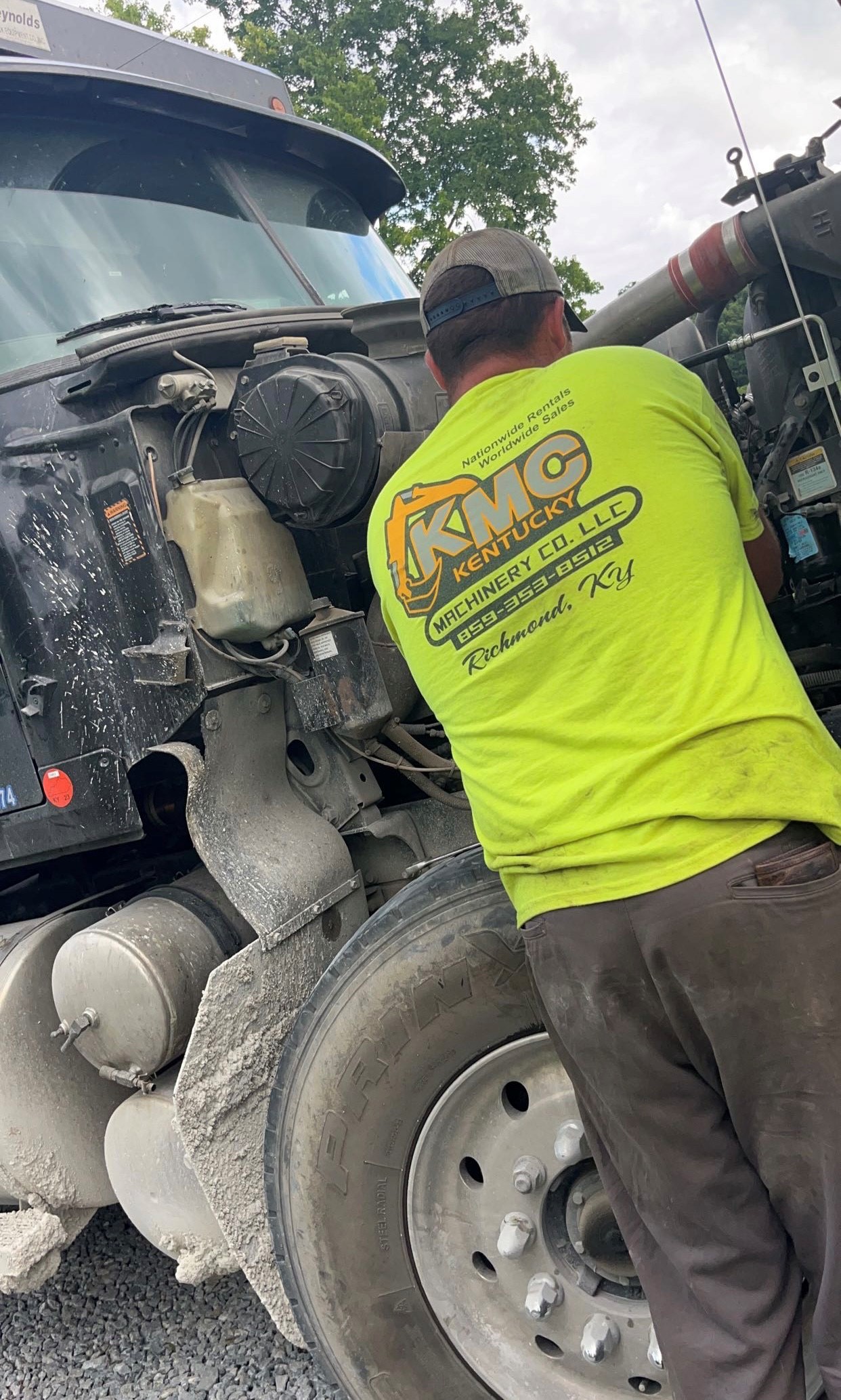 Blake Copher working on a diesel engine at his workplace.