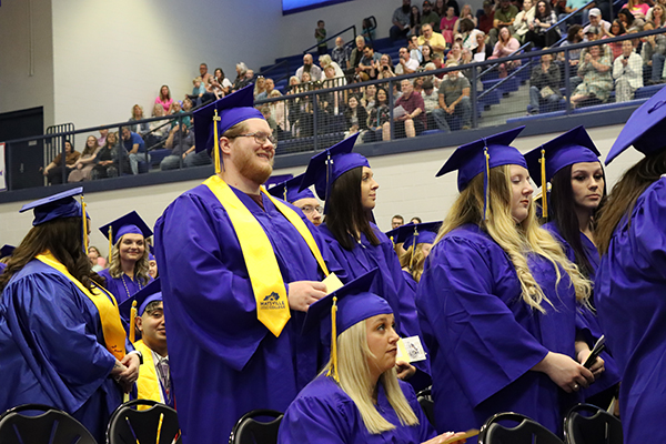 Students wearing stoles at graduation.