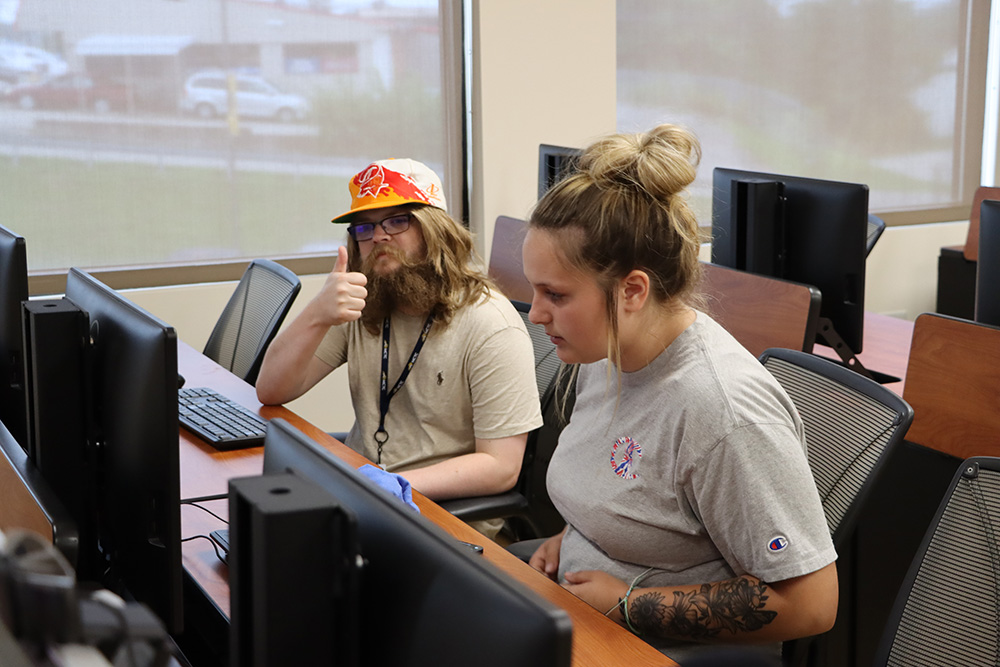IT staff helping student at the Montgomery Campus.