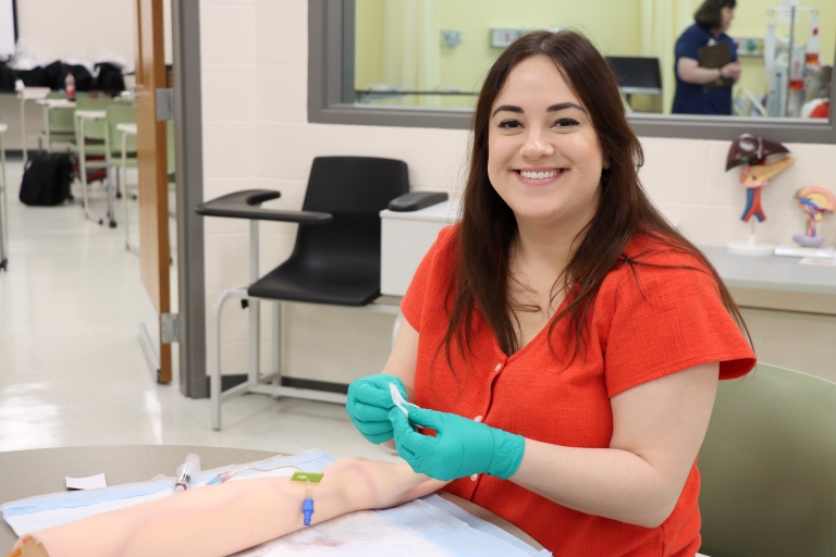 RN student practicing with an IV