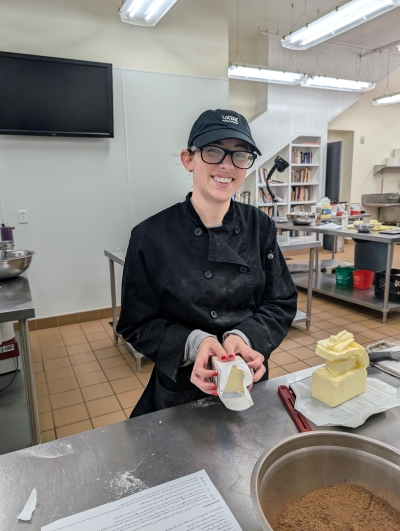 student with butter at the bakery