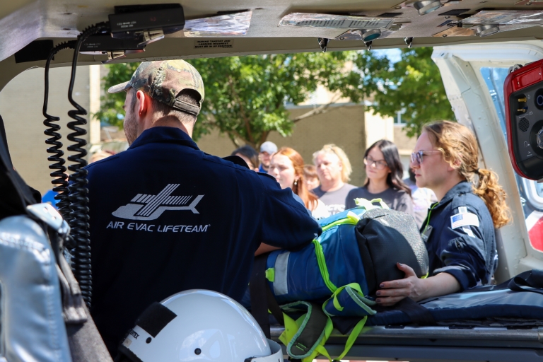 Air Evac Lifeteam in their helicopter with their uniforms on