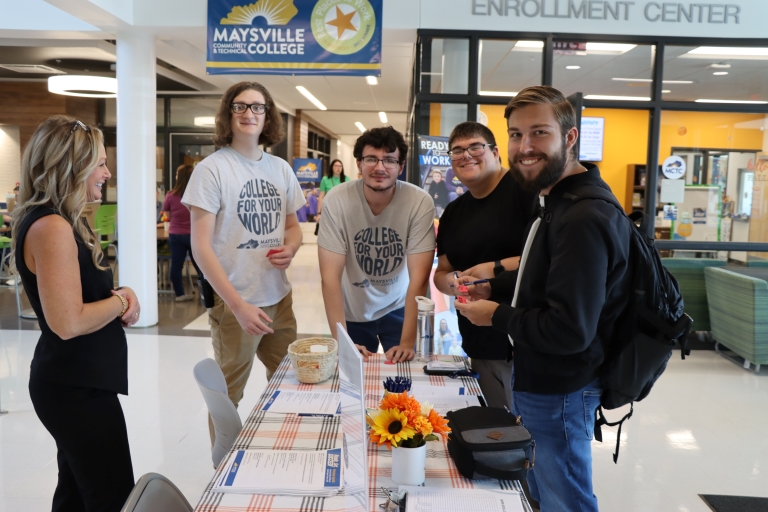 group of students at Ready, Set, Succeed around a table