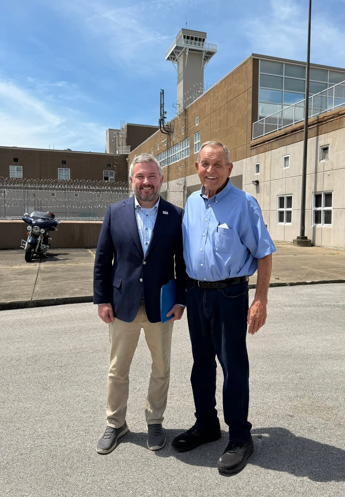 Dr. Quarles and Kentucky State Representative Richard White standing in front of the Eastern Kentucky Correctional Complex.