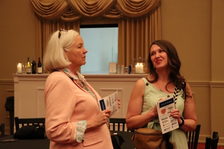 two ladies talking at the WJM 2026 event