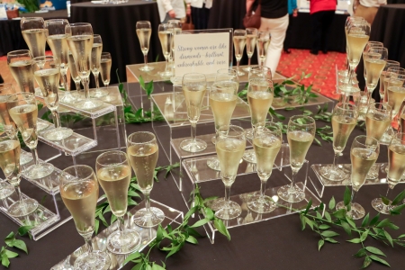 glasses of wine sitting on a table at the event